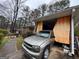 Carport featuring a vehicle parked inside with curtain-like material hanging nearby at 2234 Glendale Dr, Decatur, GA 30032