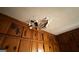Damaged ceiling with a large hole and water damage above wood paneling at 2234 Glendale Dr, Decatur, GA 30032