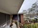 A view of the front of the home with overgrown bushes at 2234 Glendale Dr, Decatur, GA 30032