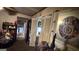 Cluttered hallway with a view into other rooms, various furniture, and items piled throughout at 2234 Glendale Dr, Decatur, GA 30032
