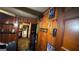 Wood-paneled hallway with multiple doorways and various items and pictures along the walls at 2234 Glendale Dr, Decatur, GA 30032