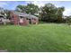 Lovely brick home with green trim, a covered entry, and a large, well-maintained lawn at 359 Keys Ferry St, Mcdonough, GA 30253