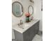 Updated bathroom features a dual sink vanity, modern mirrors, and granite countertops at 4230 Vinca Way, Union City, GA 30291