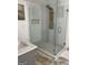 This bathroom features a luxurious glass enclosed shower and stone flooring at 4230 Vinca Way, Union City, GA 30291