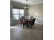 Bright dining area features a decorative chandelier and wainscoting around the perimeter at 4230 Vinca Way, Union City, GA 30291