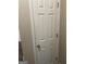 A white paneled door with a brass handle and hinges adds a classic touch at 4230 Vinca Way, Union City, GA 30291