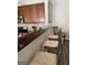 Kitchen featuring barstool seating, dark countertops and decorative lighting at 4230 Vinca Way, Union City, GA 30291