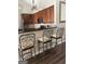 Open kitchen featuring barstool seating, dark countertops and pendant lighting at 4230 Vinca Way, Union City, GA 30291