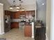 Open kitchen with stainless steel appliances, dark countertops, and ample cabinet space at 4230 Vinca Way, Union City, GA 30291