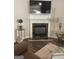 Cozy living room with a fireplace, a mounted television, and stylish decor at 4230 Vinca Way, Union City, GA 30291