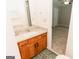 Bathroom featuring a granite countertop vanity, sink, and view of bedroom next door at 134 Ashwood Dr, Waco, GA 30182