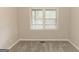 A bedroom features natural light and neutral colors on the walls and plush carpeting at 134 Ashwood Dr, Waco, GA 30182