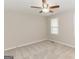 Bedroom with neutral carpeting, window and ceiling fan at 134 Ashwood Dr, Waco, GA 30182