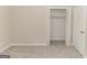 An airy bedroom showcases a double door closet, neutral walls and plush carpeting at 134 Ashwood Dr, Waco, GA 30182