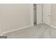 Bright bedroom featuring a closet with double doors, neutral walls and plush carpeting at 134 Ashwood Dr, Waco, GA 30182