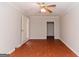 Spacious bedroom with ceiling fan, hardwood floors and two entryways at 134 Ashwood Dr, Waco, GA 30182