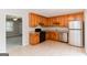 Kitchen features wood cabinets, stainless appliances, and granite counters at 134 Ashwood Dr, Waco, GA 30182