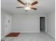Cozy living room featuring neutral paint, new carpet, and bright ceiling fan at 134 Ashwood Dr, Waco, GA 30182
