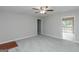 Spacious living room featuring neutral paint, new carpet, and ceiling fan at 134 Ashwood Dr, Waco, GA 30182