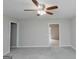 Carpeted living room with neutral walls and views to other rooms at 134 Ashwood Dr, Waco, GA 30182