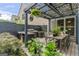 Outdoor space with grill, dining table, and pergola, offering the perfect setting for backyard gatherings at 5768 Grande River Rd, Atlanta, GA 30349