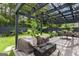 Relaxing backyard deck with a pergola, outdoor seating, barbecue grill, and a cozy fire pit at 5768 Grande River Rd, Atlanta, GA 30349