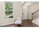 Entryway area with hardwood floors, chair, staircase and window at 5768 Grande River Rd, Atlanta, GA 30349