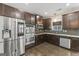 Well-equipped kitchen with stainless steel appliances, granite counters, and dark cabinets at 5768 Grande River Rd, Atlanta, GA 30349