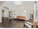 Bright living room with hardwood floors, neutral walls, an archway, and stylish modern decor at 5768 Grande River Rd, Atlanta, GA 30349