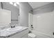 Bathroom featuring granite counters, tiled floors and modern fixtures at 180 E Ranchette Rd, Temple, GA 30179