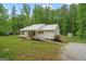 Charming home with a welcoming front porch and accessible ramp at 180 E Ranchette Rd, Temple, GA 30179