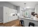 Bright kitchen with white cabinets, granite countertops, and a stainless steel refrigerator at 180 E Ranchette Rd, Temple, GA 30179