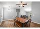 Open-concept living area featuring a dining table and stylish light fixtures at 180 E Ranchette Rd, Temple, GA 30179