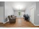 Inviting living room with ample natural light, wood flooring, and cozy furnishings at 180 E Ranchette Rd, Temple, GA 30179