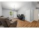 Spacious living room with wood floors, neutral walls, and comfortable seating area at 180 E Ranchette Rd, Temple, GA 30179