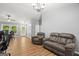 Open living space with wood floors, neutral walls, and comfortable seating at 180 E Ranchette Rd, Temple, GA 30179