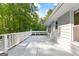 Back deck showcasing wooded views and exterior of home at 295 Merrydale Dr, Fayetteville, GA 30215