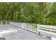 Wood deck with wooded views and access stairs at 295 Merrydale Dr, Fayetteville, GA 30215
