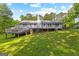 Gorgeous home exterior featuring a large deck overlooking a well-manicured backyard at 295 Merrydale Dr, Fayetteville, GA 30215
