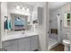 Bathroom featuring a white vanity, mirror, and accessible shower with a built in folding seat at 295 Merrydale Dr, Fayetteville, GA 30215