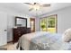 Bedroom featuring a bed, dresser, and a window offering plenty of natural light at 295 Merrydale Dr, Fayetteville, GA 30215