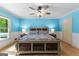 Bedroom featuring a bed, side tables with lamps, and a large window offering plenty of natural light at 295 Merrydale Dr, Fayetteville, GA 30215