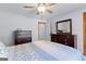 Bedroom featuring a bed, dresser, and a mirror at 295 Merrydale Dr, Fayetteville, GA 30215