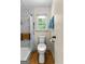 Bright bathroom featuring an accessible toilet and a tiled shower with safety bars at 295 Merrydale Dr, Fayetteville, GA 30215