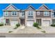 Attractive townhomes featuring single-car garages, private driveways, and colorful facades at 5009 Longview Walk, Decatur, GA 30035
