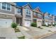 Charming townhome featuring a private driveway, single car garage and a beautifully designed exterior at 5009 Longview Walk, Decatur, GA 30035