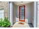 Inviting front entrance featuring a red door with glass inset and stylish exterior finishes at 5009 Longview Walk, Decatur, GA 30035