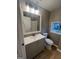 Bathroom featuring modern vanity with mirror at 2502 Barge Sw Rd, Atlanta, GA 30331