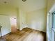 Bright, spacious bedroom with laminate flooring, showcasing ample natural light and closet space at 2502 Barge Rd Sw, Atlanta, GA 30331
