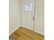 Bright entryway with durable floors, complemented by a classic white door and neutral walls at 2502 Barge Sw Rd, Atlanta, GA 30331